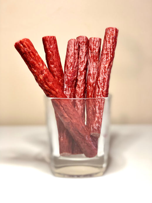 Beringer Family Farms 21 Day Dry Aged Angus Beef Collection. Photo of 6 snack sticks in a jar.